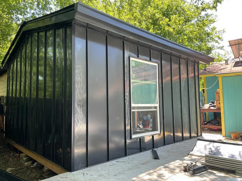 Black standing seam metal wall panels for Roof Inspection in Petoskey