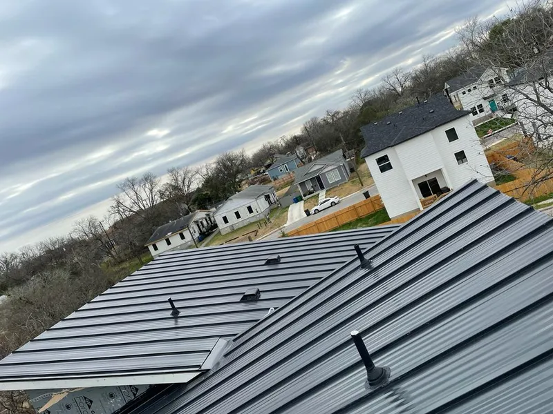 Standing seam metal roof panels with vents for Skylight Repair in Petoskey